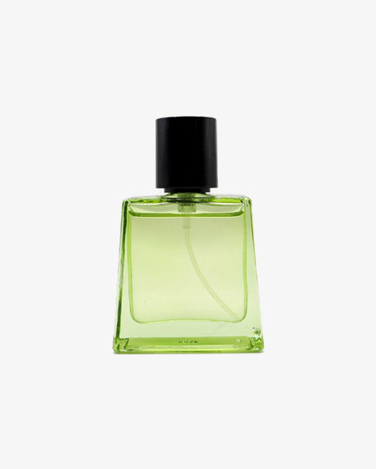 Green perfume bottle with black cap on a white background
