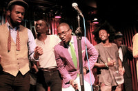 a group of people performing on stage