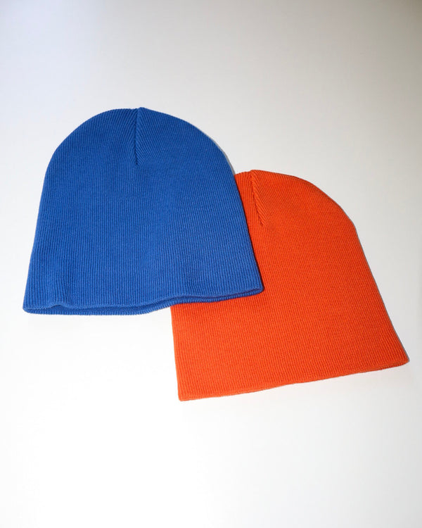 Blue and orange beanies on a white background