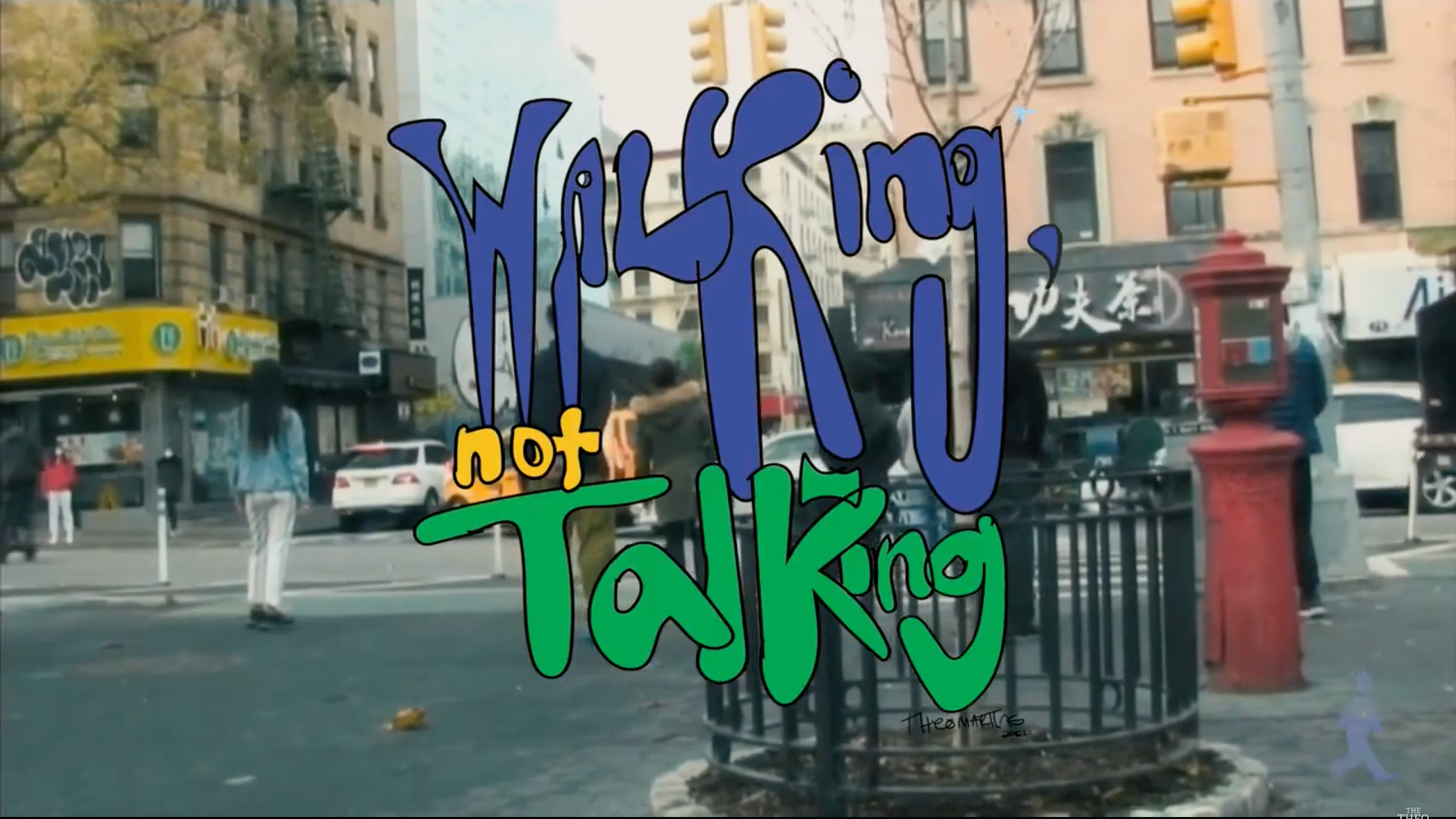 Colorful text 'Walking, not Talking' over a city street scene with buildings and a red fire hydrant.