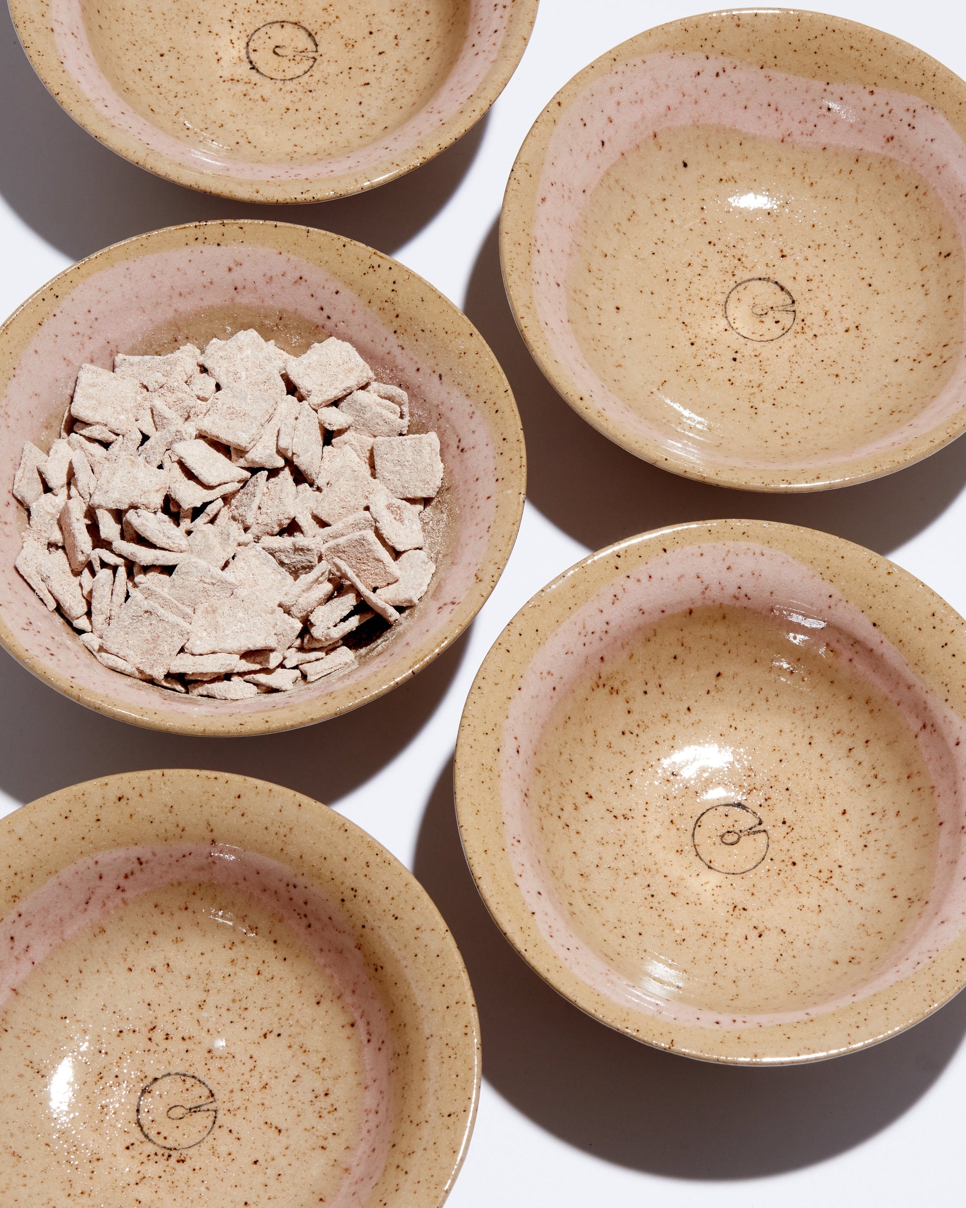 Set of ceramic bowls with a textured finish on a white background
