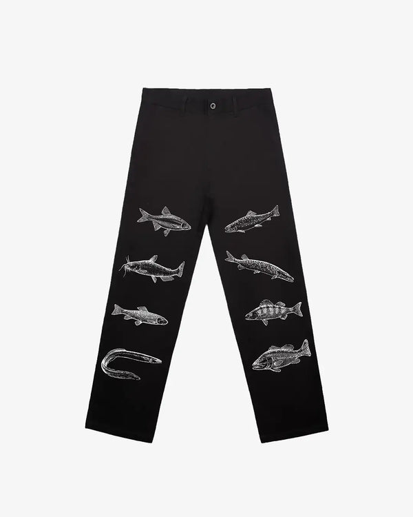Black pants with fish and hook designs on a white background