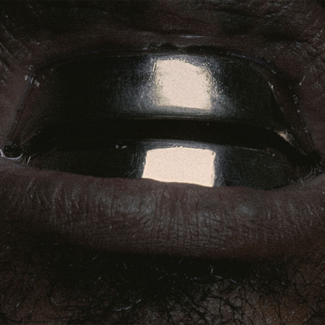 Close-up of a person's MOUTH with a dark background