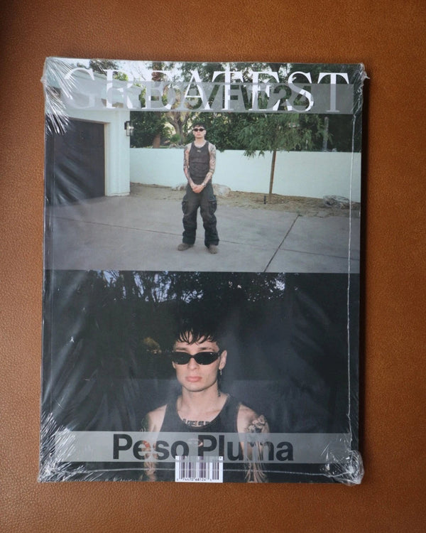 Packaged album with 'Peso Pluma' on a brown surface