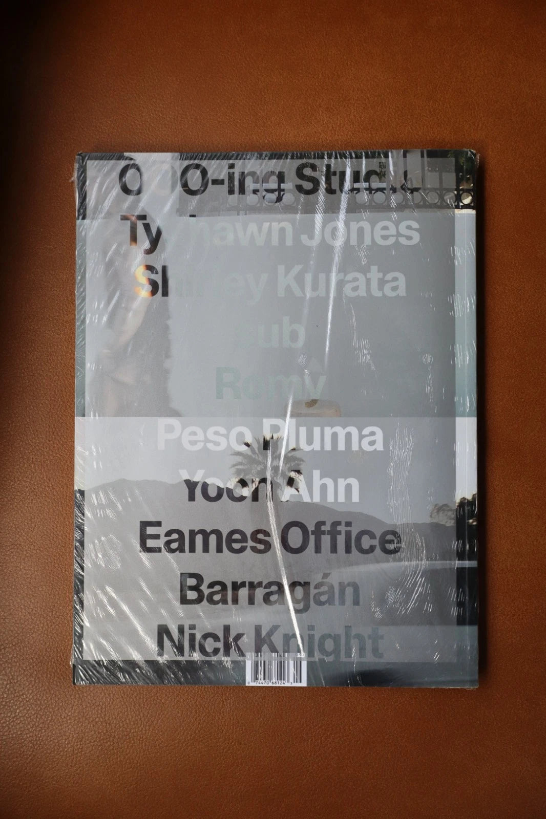 Book or magazine with text on a brown background